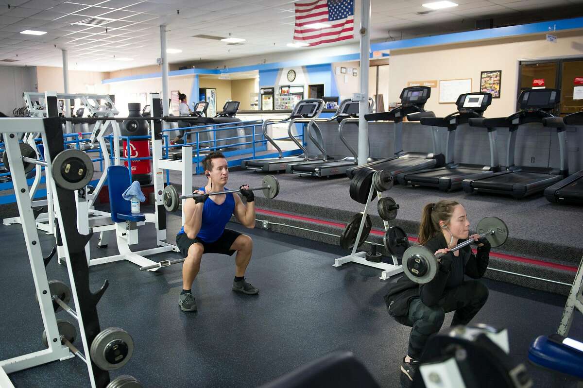 Cody Eliason and Sam Bandy, both of Marysville, workout at Future Fitness in Yuba City, Calif. on Wednesday, May 6, 2020.