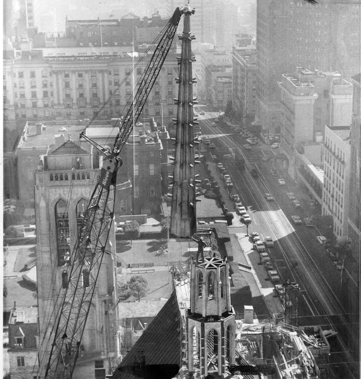 The new spire is being lifted onto Grace Cathedral, March 19, 1963 The spire weighs apron. 5 tons, and is surmounted by a gold cross that measures 17 ft. 5 inches in height Photo ran 3/20/1963, p. 1 Associated Press photo