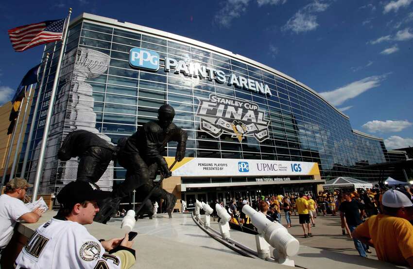 FILE - In this May 29, 2017, file photo, fans wait outside PPG Paints Arena for Game 1 of the NHL hockey Stanley Cup Finals between the Pittsburgh Penguins and the Nashville Predators, in Pittsburgh. PPG Paints Arena is one of the possible locations the NHL has zeroed in on to host playoff games if it can return amid the coronavirus pandemic. The league will ultimately decide on two or three locations for games, with government regulations, testing and COVID-19 frequency among the factors for the decision that should be coming within the next three to four weeks. (AP Photo/Gene J. Puskar, File)