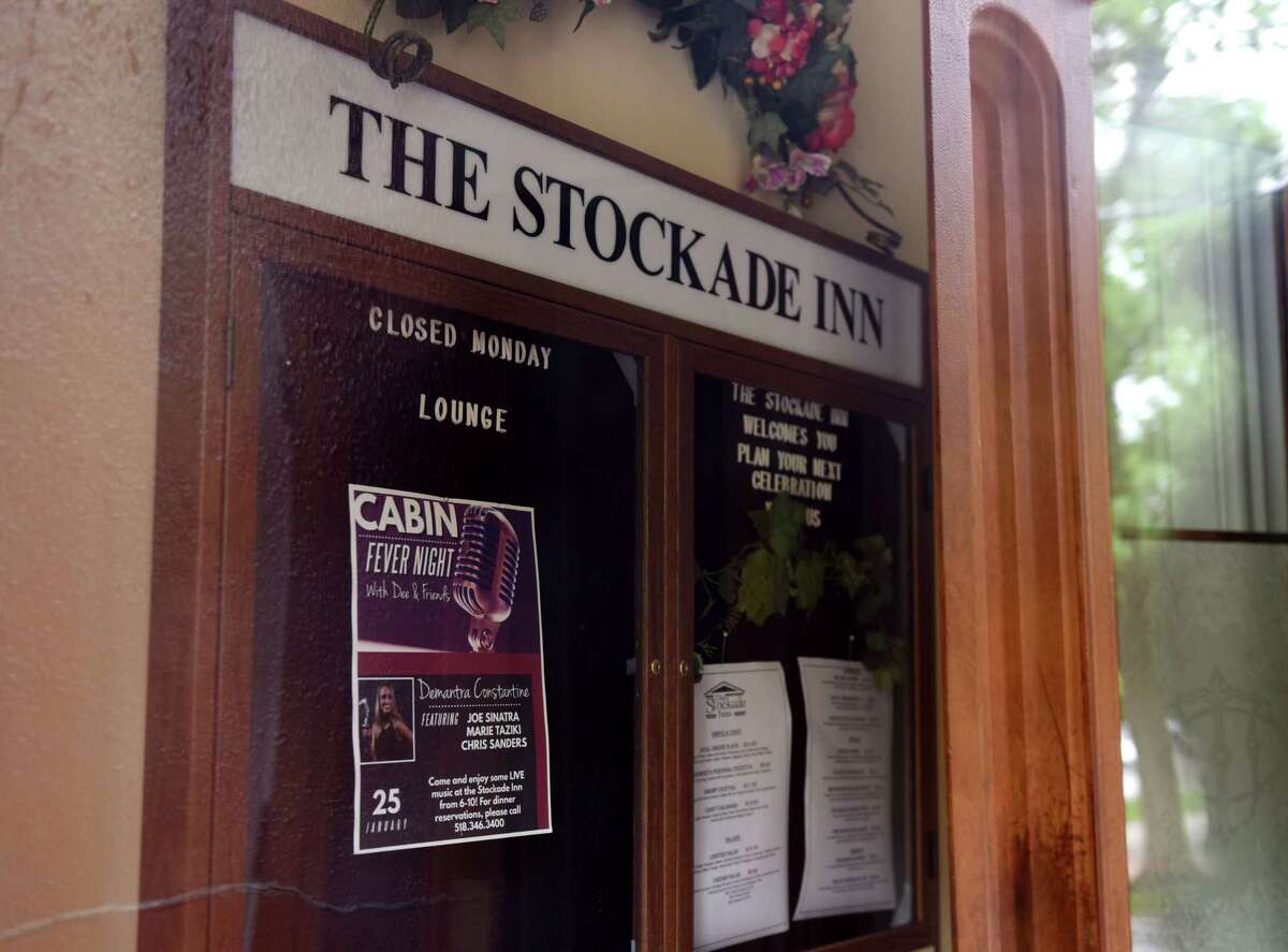 Signs in the doorway of the Stockade Inn date back to when the venue was once open on Thursday May, 28, 2020, on in Schenectady, N.Y. Redburn Development is negotiating to buy the now-shuttered Stockade Inn in Schenectady with a plan to turn the building boutique hotel and restaurant into apartments and offices. (Will Waldron/Times Union)