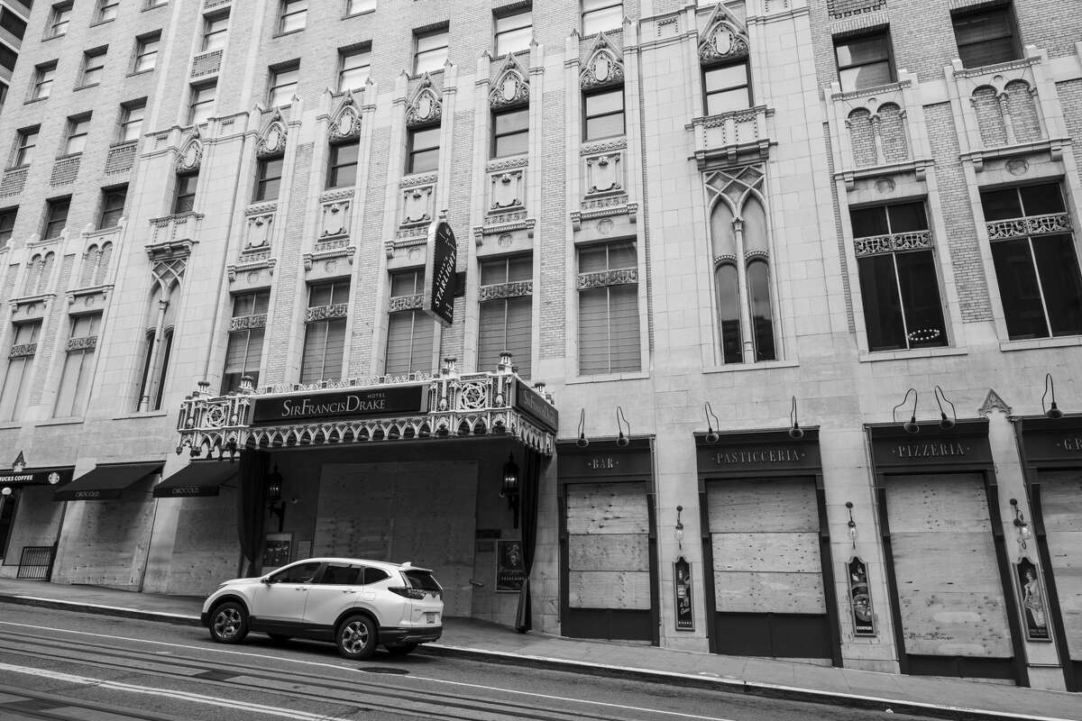 The Sir Francis Drake Hotel, known for its Beefeater doormen, is boarded up and closed at Union Square in San Francisco on April 17, 2020. 