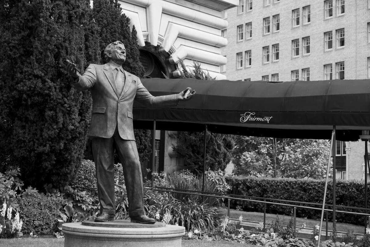 A statue of singer Tony Bennett stands outside the closed Fairmont Hotel in San Francisco on April 17, 2020.