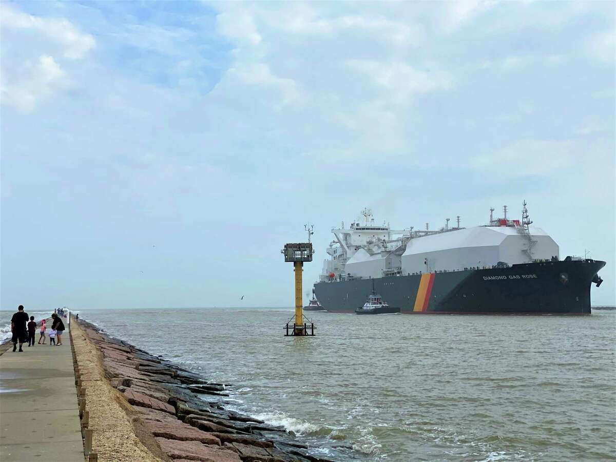 Families and surfers are indifferent as a liquefied natural gas tanker named the Diamond Gas Rose enters the Freeport Ship Channel at Surfside Beach on Sunday, February 9, 2020. The ship traveled 36 days to get to the port from Shanghai, China and will leave with shipment from Freeport LNG.