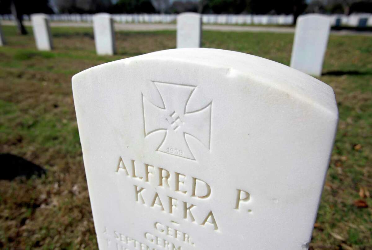 The headstone for World War II prisoner of war Alfred P. Kafka, seen in 2012 at Fort Sam Houston National Cemetery, bears an Iron Cross and swastika, a military decoration modified by the Nazis in 1933. Some 141 POWs are interred at the cemetery.