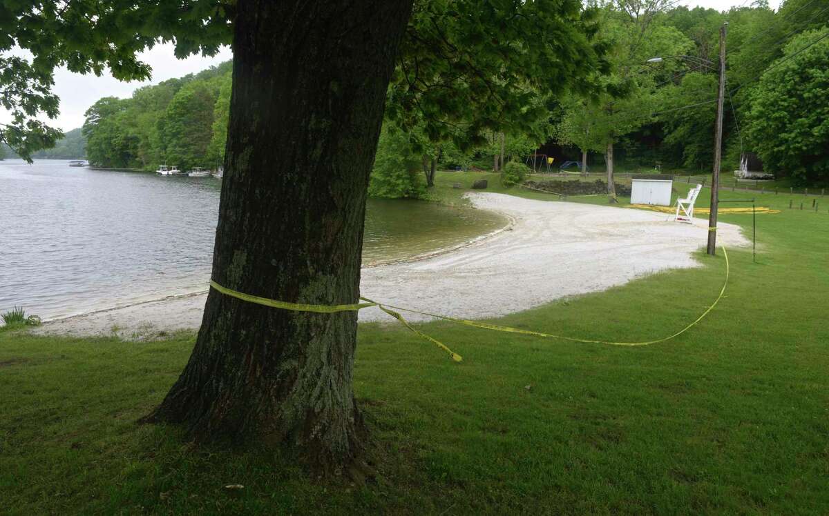 The Sherman Town Beach on Candlewood Lake is closed on Thursday afternoon. Sherman and other towns on the lake did not open their beaches for Memorial Day weekend. May 28, 2020, in Conn.