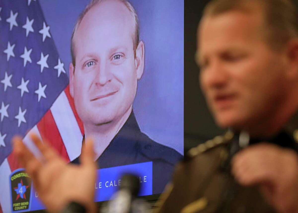 A photo of Fort Bend County Precinct 4 Deputy Constable Caleb Rule is seen as Fort Bend County Sheriff Troy Nehls speaks during a press conference Friday, May 29, 2020, in Richmond. Earlier in the morning, a Fort Bend County Deputy Sheriff fatally shot Rule after mistaking him for an intruder as they cleared a house in nearby Missouri City. Rule was flown to Memorial Hermann hospital, but he did not survive.