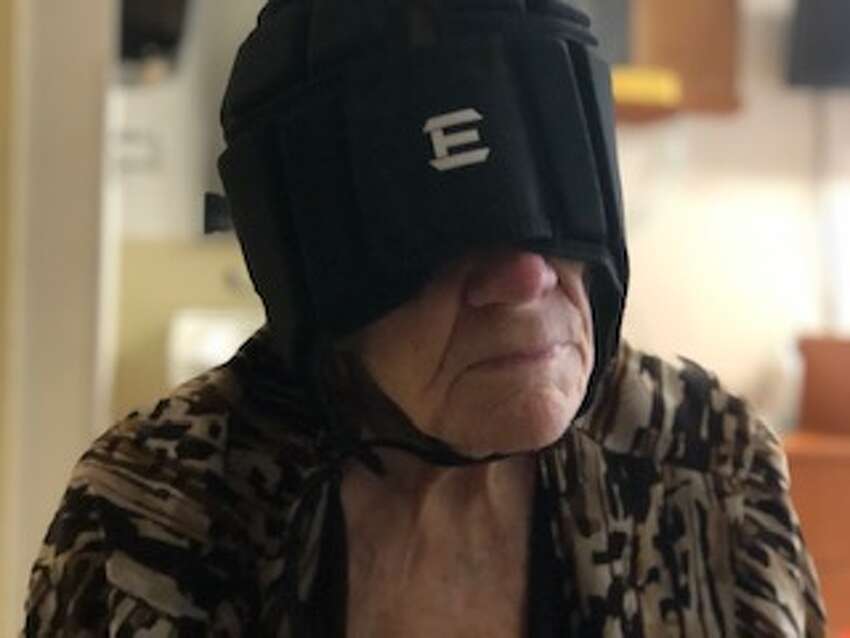 Mary Beth Delarm began documenting visits to her mother at the Diamond Hill nursing home in Schaghticoke last year. She believes her mother, who is in her 90s and has dementia, was being neglected based on the conditions she often found her in. In this photo, Delarm arrived to find her mother blinded by a fall-risk helmet that hadn't been properly fitted.