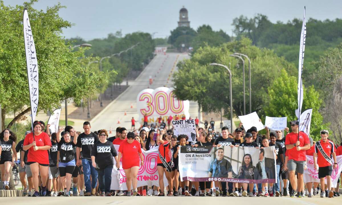 Incoming Texas A&M freshman walk the "Miracle Mile" from the Torre de Esperanza to the fountain where they were greeted by upperclassmen, faculty and staff as the school year starts at the south side campus.