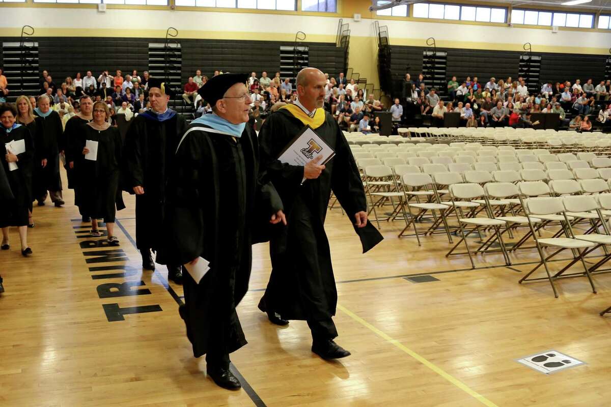 Trumbull High School Principal Marc Guarino and then-Superintendant of Schools Gary Cialfi lead the procession of faculty and students Trumbull High’s 2015 graduation.