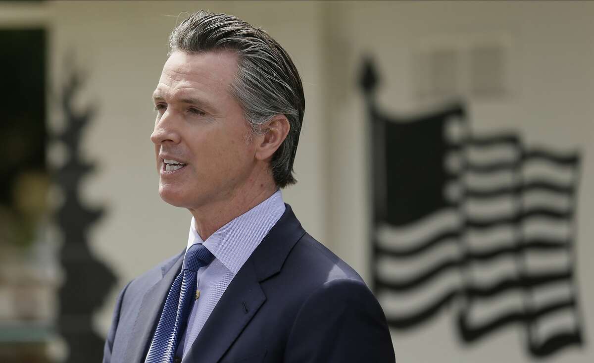 FILE - In this Friday, May 22, 2020, file photo, California Gov. Gavin Newsom speaks during a news conference at the Veterans Home of California in Yountville, Calif.