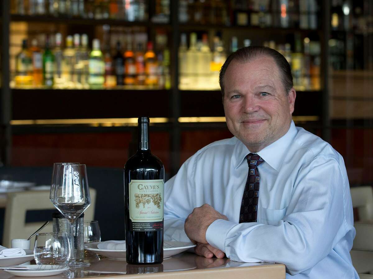 Napa Valley vineyard owner and winemaker Chuck Wagner sits with a bottle of his 2011 Caymus Vineyards Special Selection Cabernet Sauvignon in Miami Beach, Fla. on Thursday, Feb. 20, 2014. Wagner won Wine Spectator's Distinguished Service Award in 2007 and has numerous accolades from his very first vintages in the 1970s through the present. Wagner and Danny Meyer, CEO of Union Square Hospital Group will be honored at this year's tribute dinner during the South Beach Wine and Food Festival. (AP Photo/Wilfredo Lee)