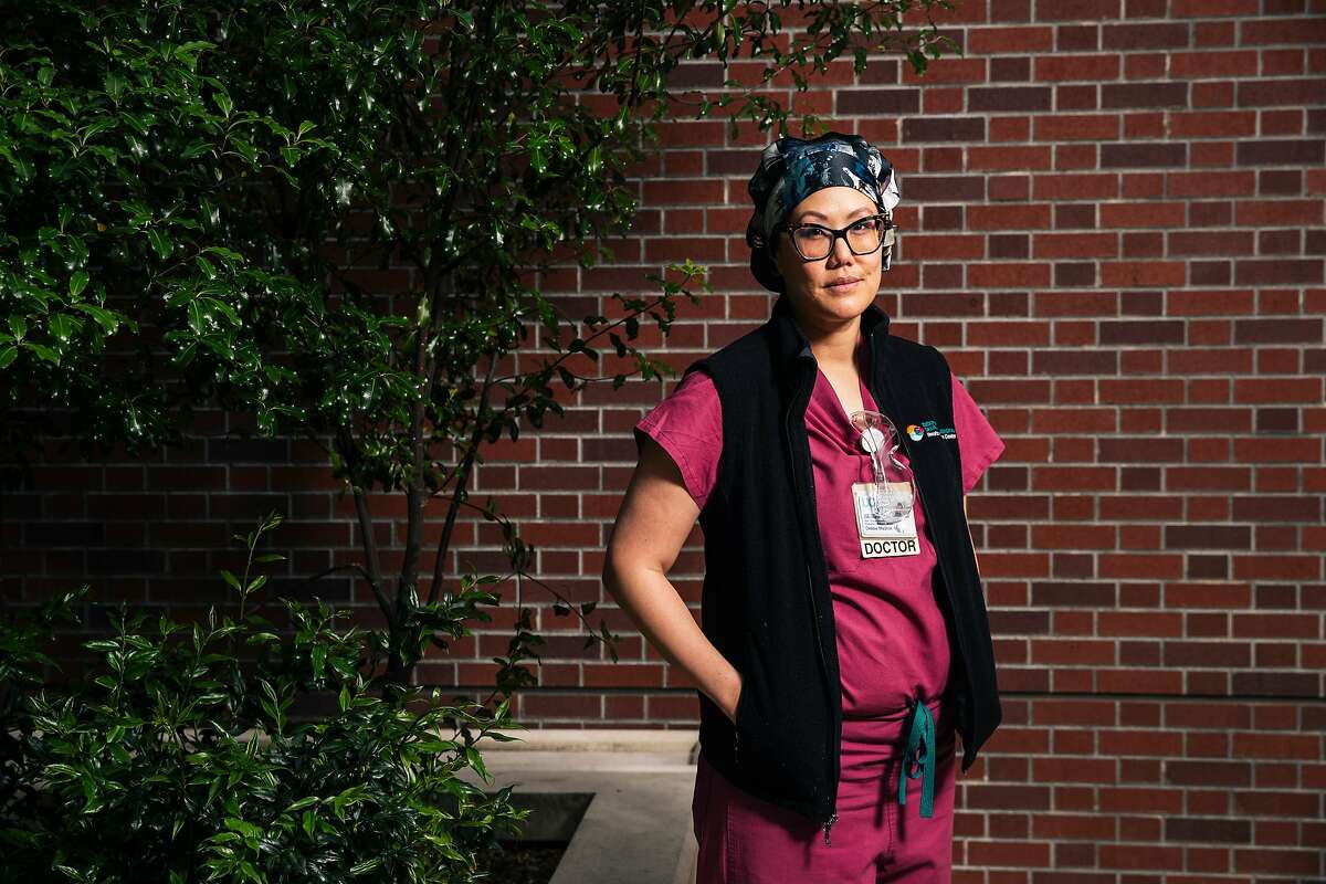 Dr. Debbie Yi Madhok, an emergency room physician at Zuckerberg San Francisco General Hospital and Trauma Center, stands for a portrait before her shift on Thursday, May 28, 2020 in San Francisco, California.