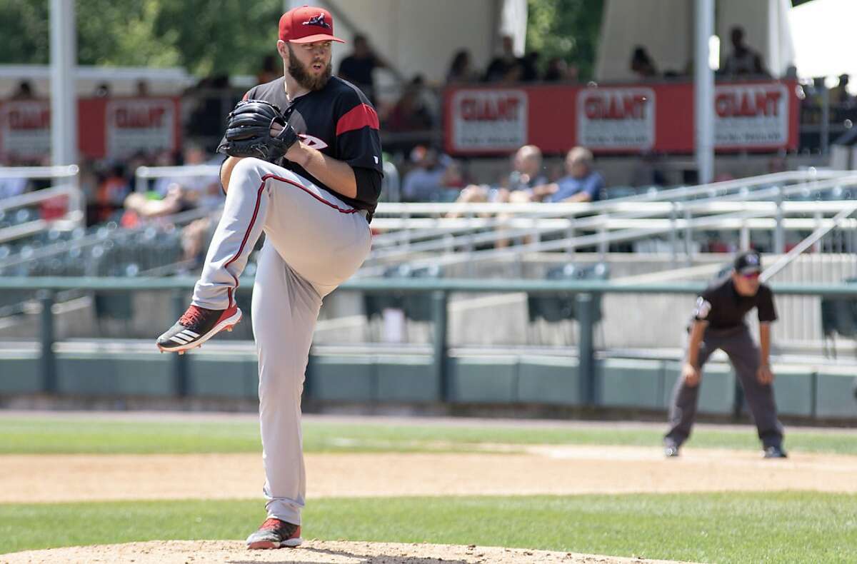 Brandon Lawson, shown pitching for Double-A Richmond, Va., last season, was one of 20 Giants minor-leaguers who were cut Tuesday.