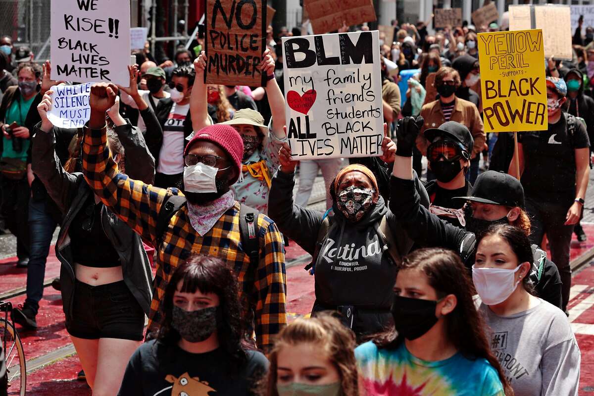 Protesters march along Market Street after a rally at City Hall on Saturday, May 30, 2020, in San Francisco, Calif. Protesters continued following the death of George Floyd, who died after being restrained by Minneapolis police officers on Memorial Day.