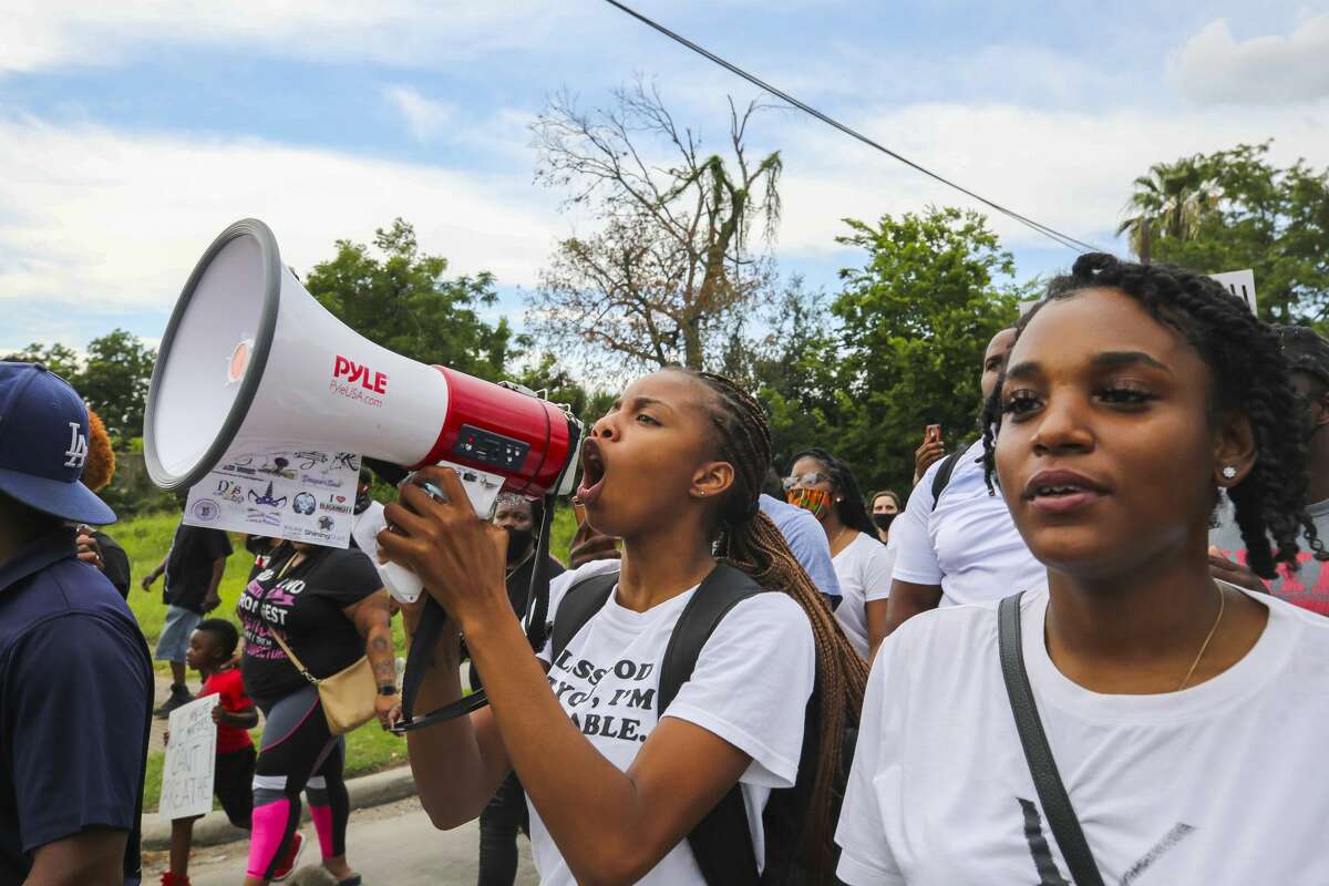 Protestors march for George Floyd, a Houston native who died in custody of the Minneapolis police earlier this week, during ongoing demonstrations Saturday, May 30, 2020 in Houston.