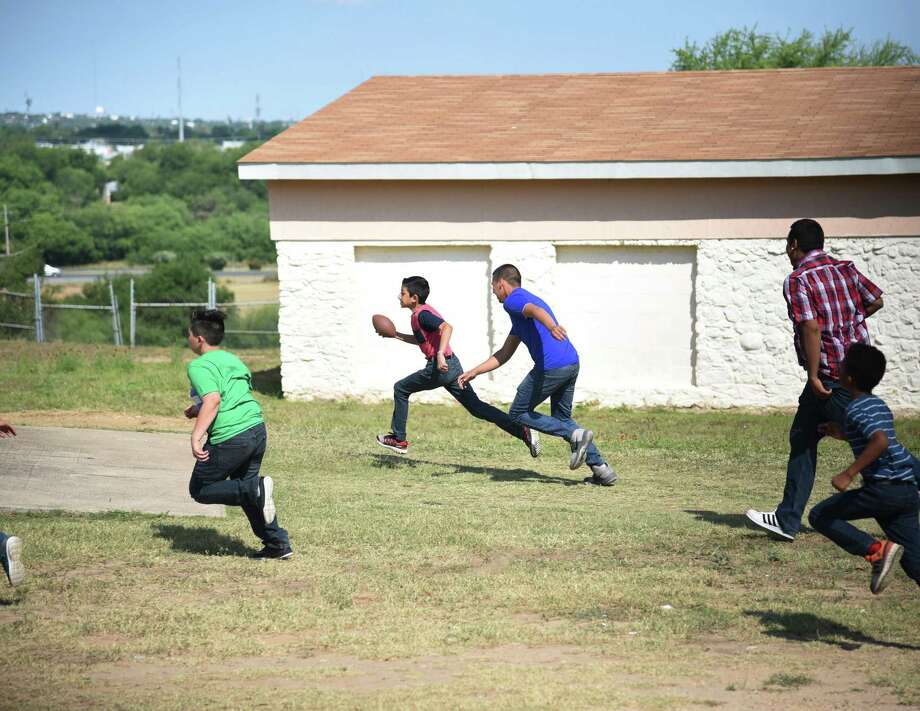 A game of football with Malicious Motorsport members is being played during the Border Skullz BBQ at Sacred Hearts Children’s Home in 2018. Photo: Christian Alejandro Ocampo /Laredo Morning Times File / Laredo Morning Times