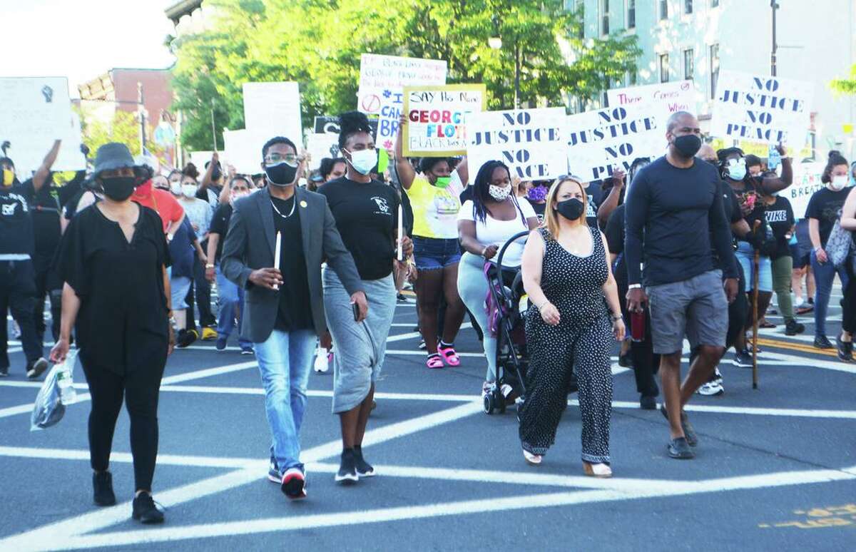 Hundreds joined a calm rally and procession down Main Street Saturday night in response to the riots in Minneapolis, Washington, D.C., New York and other major cities across the United States.