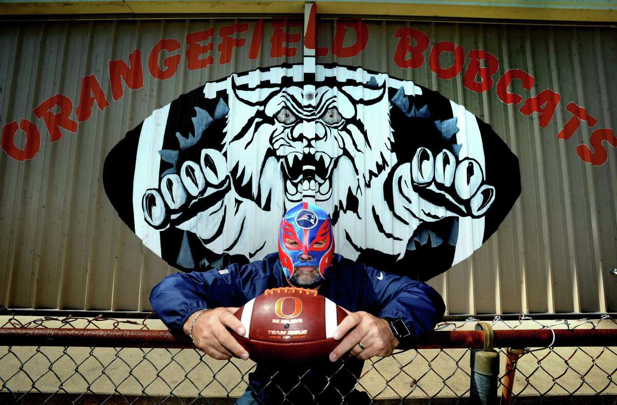 Orangefield coach Josh Smalley has tried to bring a little levity in dark times, transforming into El Patriota as he videos himself tending to the grounds and athletic facilities at the high school. A long-time New England Patriots fan, he'd received a gift of a Patriot's themed wrestling mask from a friend who'd found it during a trip to Cabo. He says he'll probably never hear the end of his in-character posts mid-quarantine, but if it makes somebody laugh while dealing with this, it's worth it. Photo taken Tuesday, May 19, 2020 Kim Brent/The Enterprise