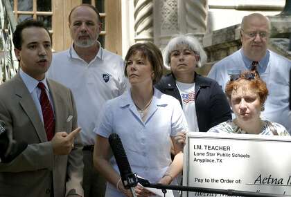 The San Antonio Alliance of Teachers and Support personnel, and the Bexar County Federation of Teachers and their supporters hold a press conference in 2004 on the steps of City Hall to protest new health reimbursement arrangements for Texas school employees. State Rep. Jose Menendez, left, is joined by Tom Cummins, Shelley Potter, Rachel Martinez, Patsy Esterline and J. B. Richeson
