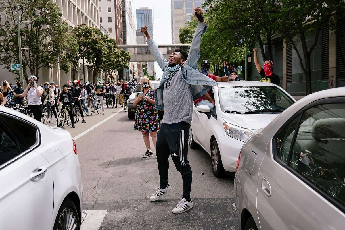 Michael Houston of Oakland chants during a Justice for George Floyd & Breonna Taylor Car Caravan in Oakland, Calif, on Sunday, May 31, 2020.