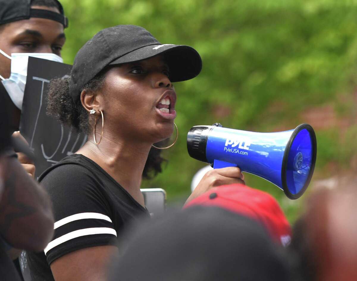 Bridgeport resident Bobbi Brown speaks during the Black Lives Matter protest at the Norwalk Police Station in South Norwalk, Conn. Sunday, May 31, 2020. About 300 people marched on I-95 to the Stamford Police Station in honor of George Floyd and all other victims of police brutality.