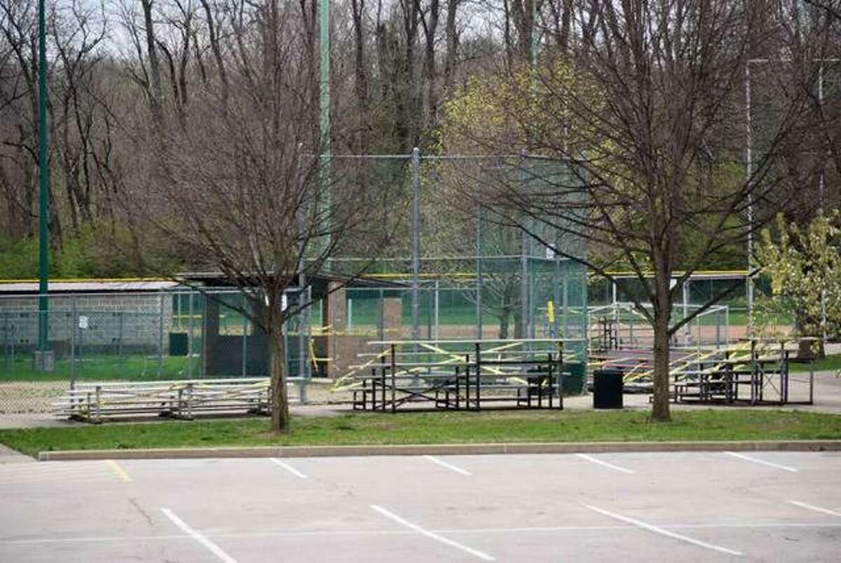 Caution tape wraps around Hoppe Park in Edwardsville in March. On Monday, the Edwardsville Glen Carbon Little League Association made the decision to cancel the season.