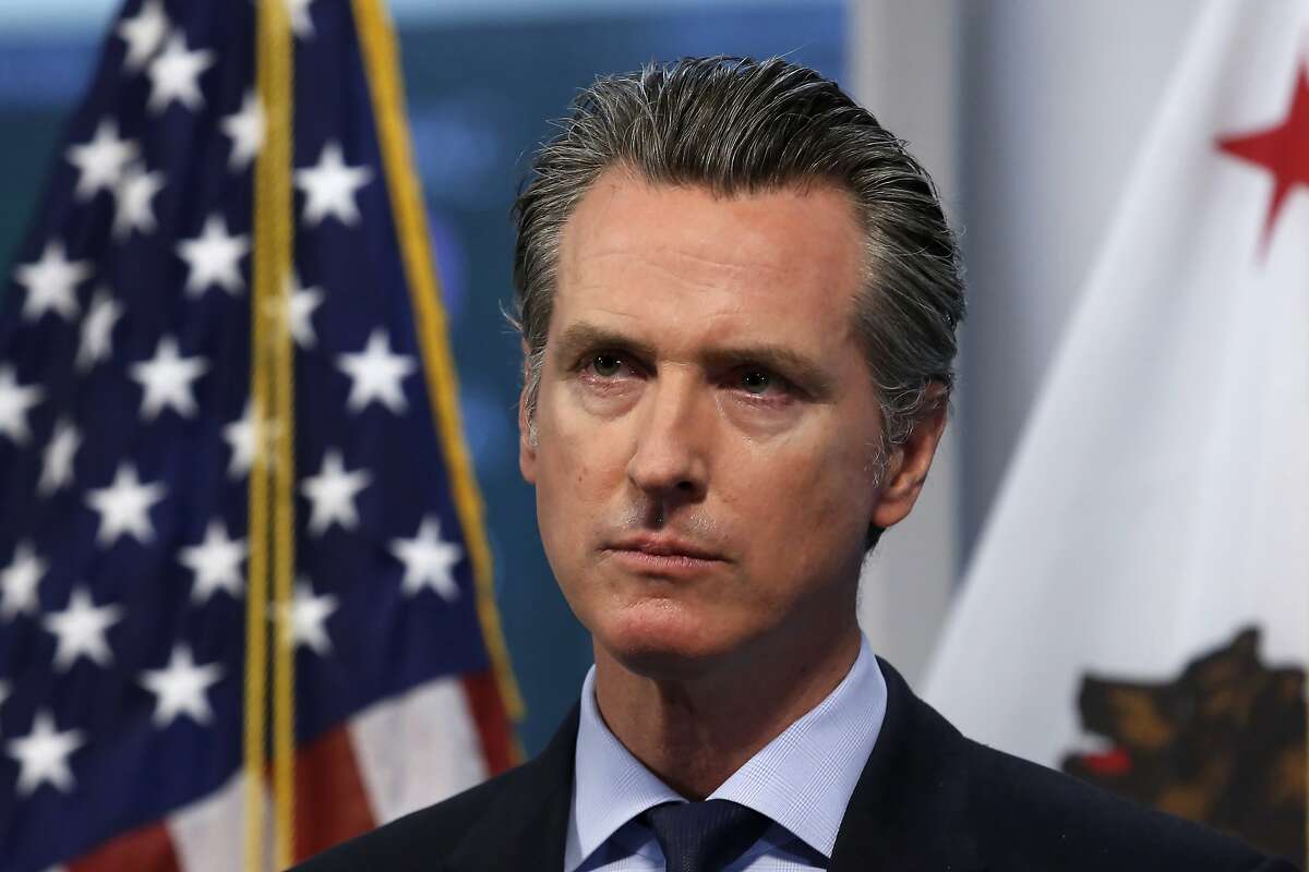 FILE - In this April 9, 2020, file photo, California Gov. Gavin Newsom listens to a reporter's question during his daily news briefing in Rancho Cordova, Calif. At his briefing Friday, May 29, 2020, Newsom gave a powerful statement on the death of George Floyd at the hands of police in Minneapolis. Newsom recounted how the death of Floyd in police custody in Minnesota impacted his four young children. Newsom said his kids broke down and cried as they struggled to understand how "bad people are supposed to be bad but good people are supposed to be good."(AP Photo/Rich Pedroncelli, Pool, File)