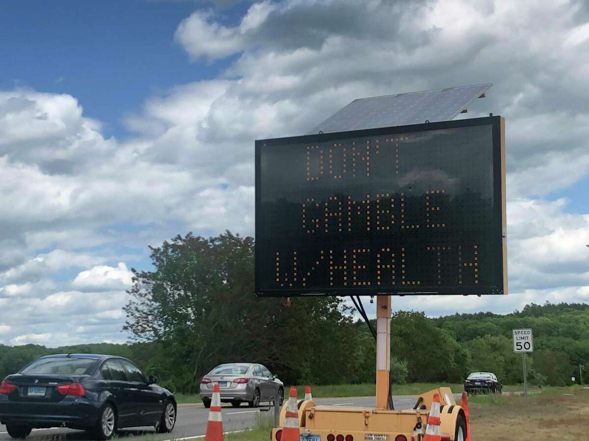 A sign warns drivers headed toward the Foxwoods Resort Casino about health risks on Monday June 1, 2020, the first day Connecticut’s tribal casinos reopened.