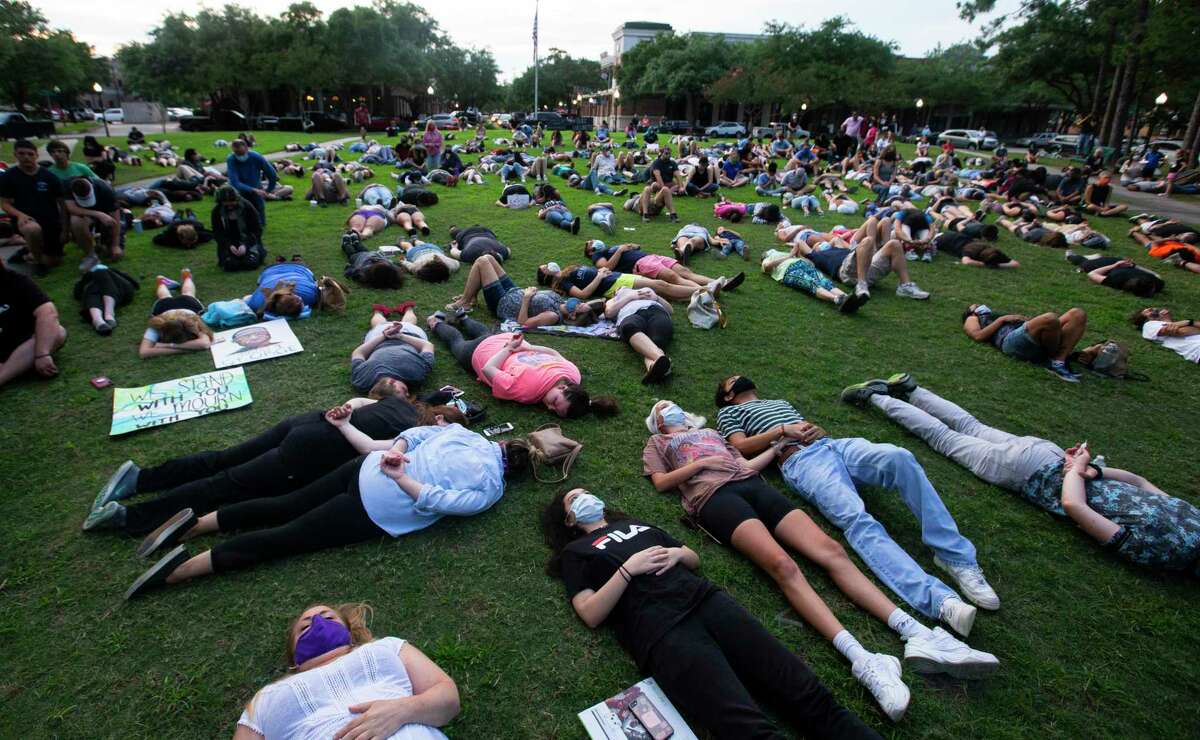 More than 200 people lay down, or kneel down, or lay in arrest position silently for eight minutes and forty-six seconds at Town Center Park to honor George Floyd, who died in Minneapolis Police Department custody a week ago, Monday, June 1, 2020, in Kingwood. The event was organized by two Humble ISD teachers, Cindy Welch and Gaby Diaz.