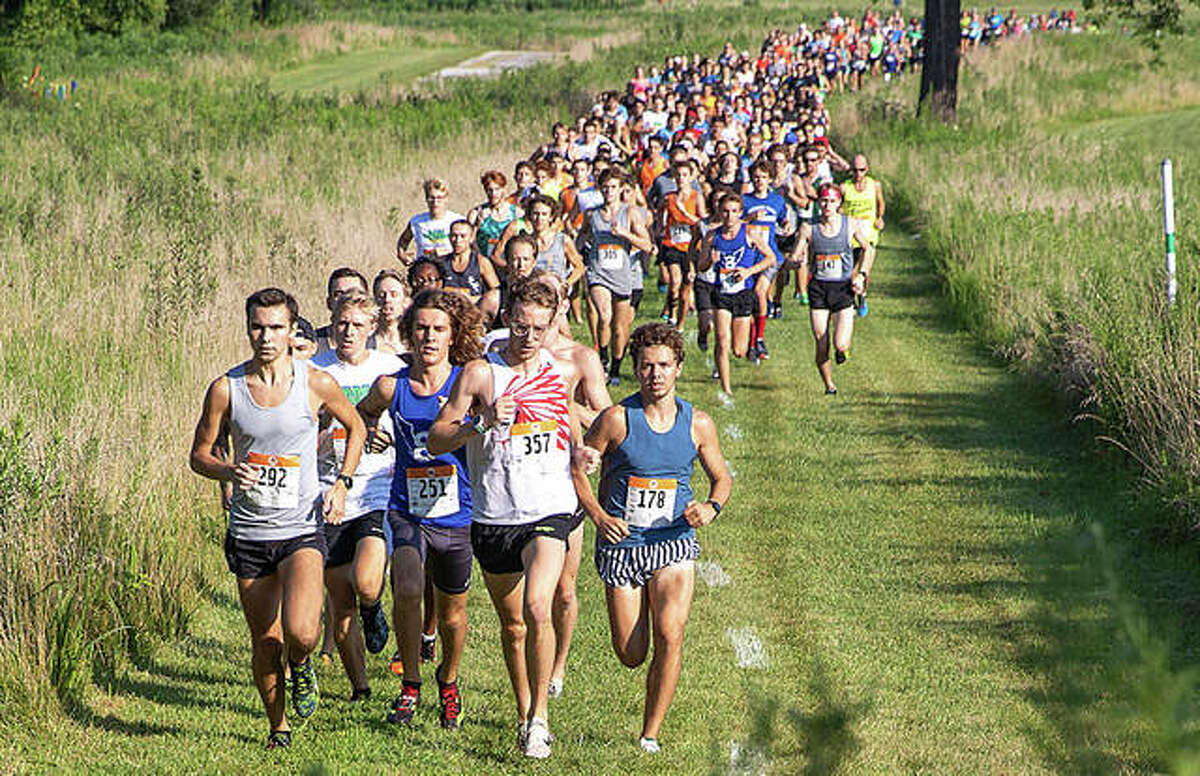 Runners take off from the starting line on July 27, 2019, during the 24th annual Mud Mountain 5K at the SIUE and EHS cross country course.