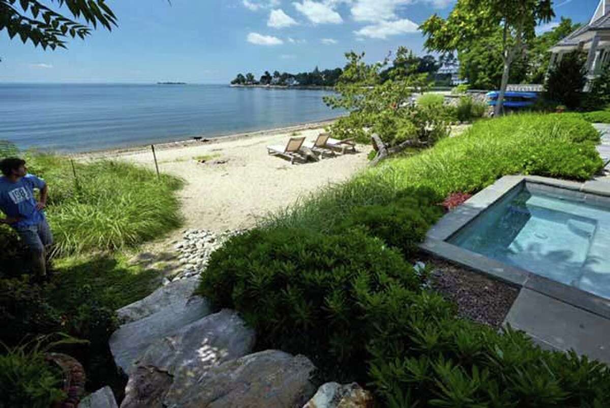 Between that arc of the sky and the sky's reflection sits this nearly new house of nine rooms and 3,967 square feet of living space. This house is the second house over the bridge and was designed by award-winning local architect Michael Greenberg & Associates and built in 2016. Virtually every room has a beautiful water view. Like Katz, the owner of this open concept home is also an artist and