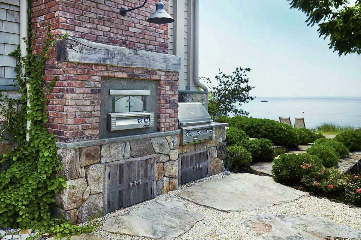 Upstairs, each of the five bedrooms have access to a massive wood deck from which to enjoy the ever-changing seascape. The master suite has a marble bath. The property also features a built-in grill and pizza oven. For more information or to set up an appointment to see the house, contact Robin Singer and Betsy Phillips of Coldwell Banker Residential Brokerage; Singer at 203-858-8405 or Robin.Singer@coldwellbankermoves.com , and Phillips at 203-216-0552 or betsy.phillipskahn@cbmoves.com.