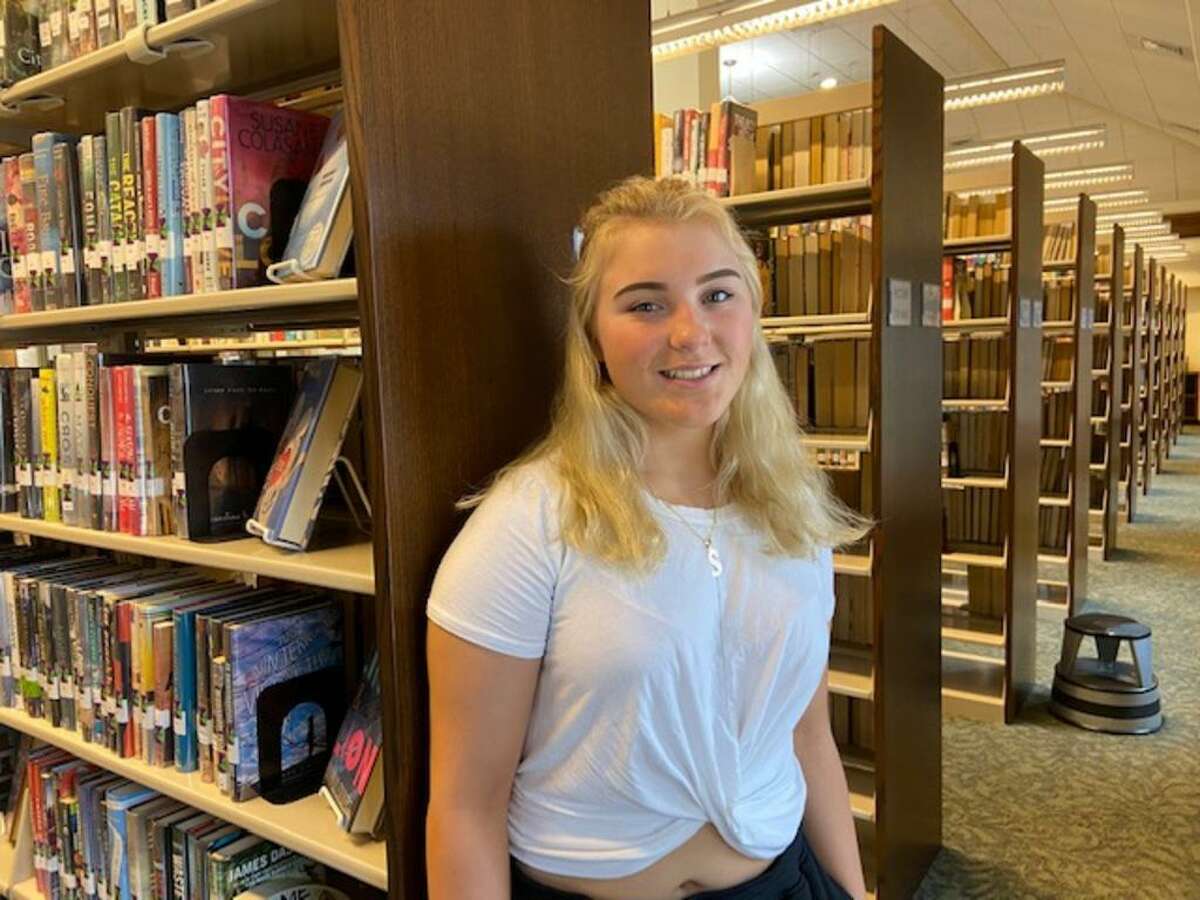 Sabrina Sault, 18, of Vernon, is a Rockville High School senior and cheerleader who says she has nearly stopped vaping after about three years. Pictured at the Rockville Public Library, she said that if she could, she would tell herself to “stop before it got to be too much.” (Photo.)
