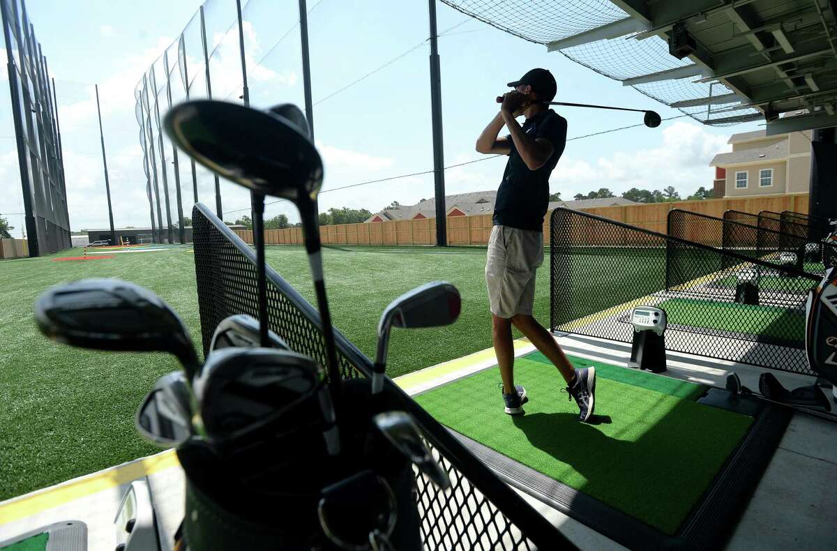 Adam Garza of Orange practices driving at 5 Under Golf Center in Beaumont Friday, May 22. He and father Ray Garza visited the establishment for the first time efore heading out to hit the links. Photo taken Friday, May 22, 2020 Kim Brent/The Enterprise