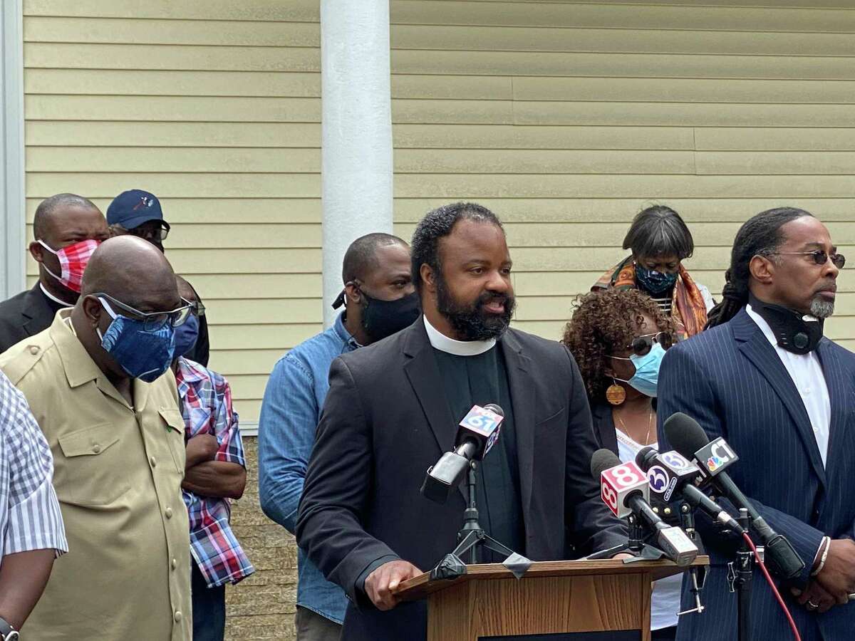 The Rev. Steven Cousin, pastor of Bethel AME Church in New Haven, speaks at a press conference praising police handling of Sunday's Black Lives Matter protest.