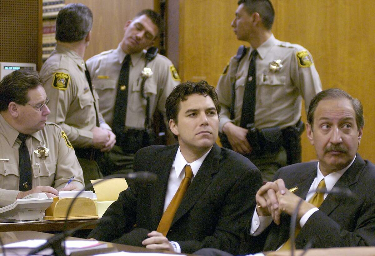 Scott Peterson, left, sits with his attorney Mark Geragos, right, during arraignment proceedings in Stanislaus Superior Court in Modesto, Calif., Wednesday morning, Dec. 3, 2003. Peterson pleaded innocent to two counts of murder in the death of his wife, Laci Peterson, and their unborn son. A trial date was set for Jan. 26. (AP Photo/Bart Ah You, Pool)