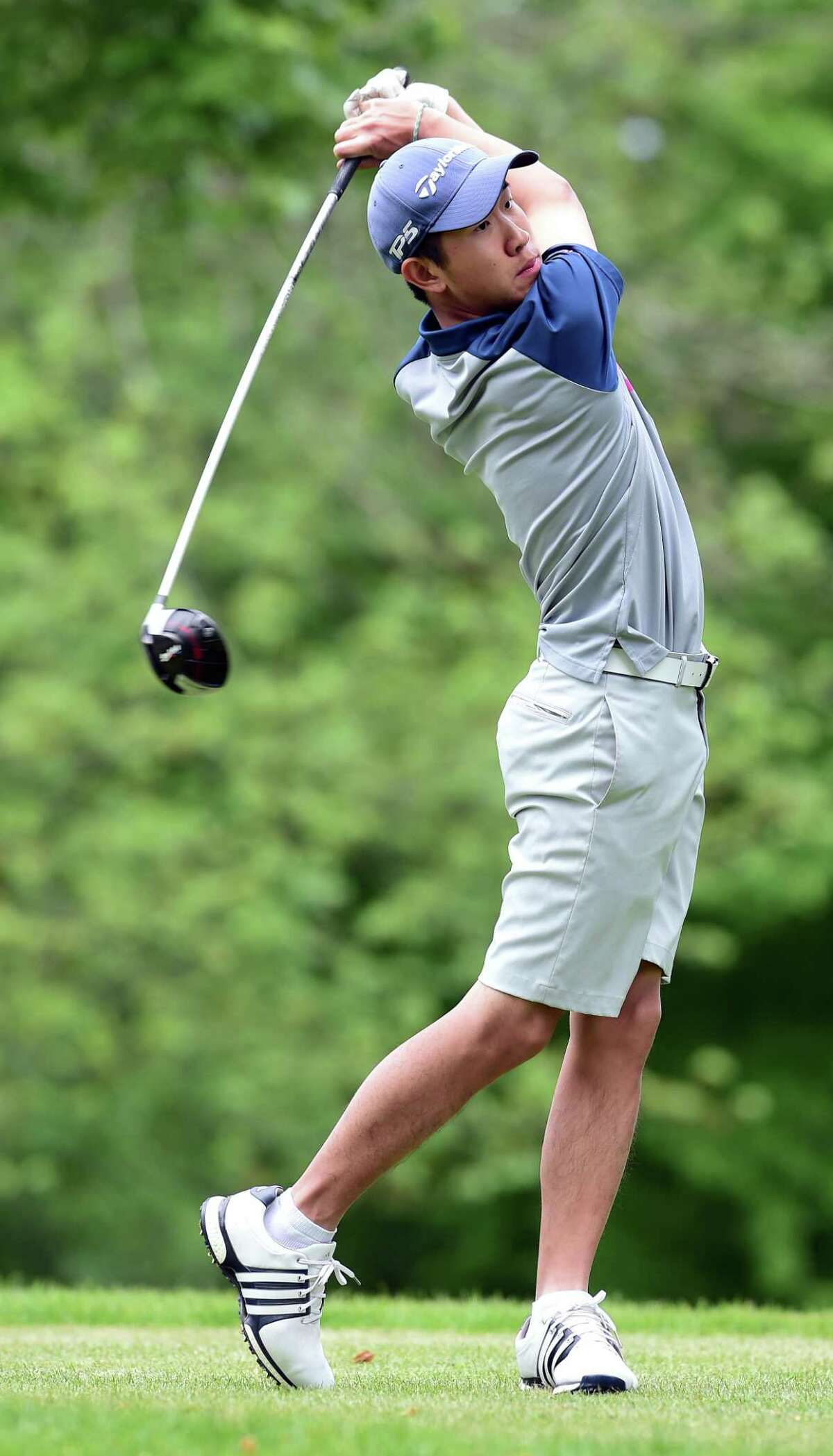 Alex Gu hits off the tee on the 10th hole at the State Amateur qualifier at Oronoque Country Club on Tuesday.