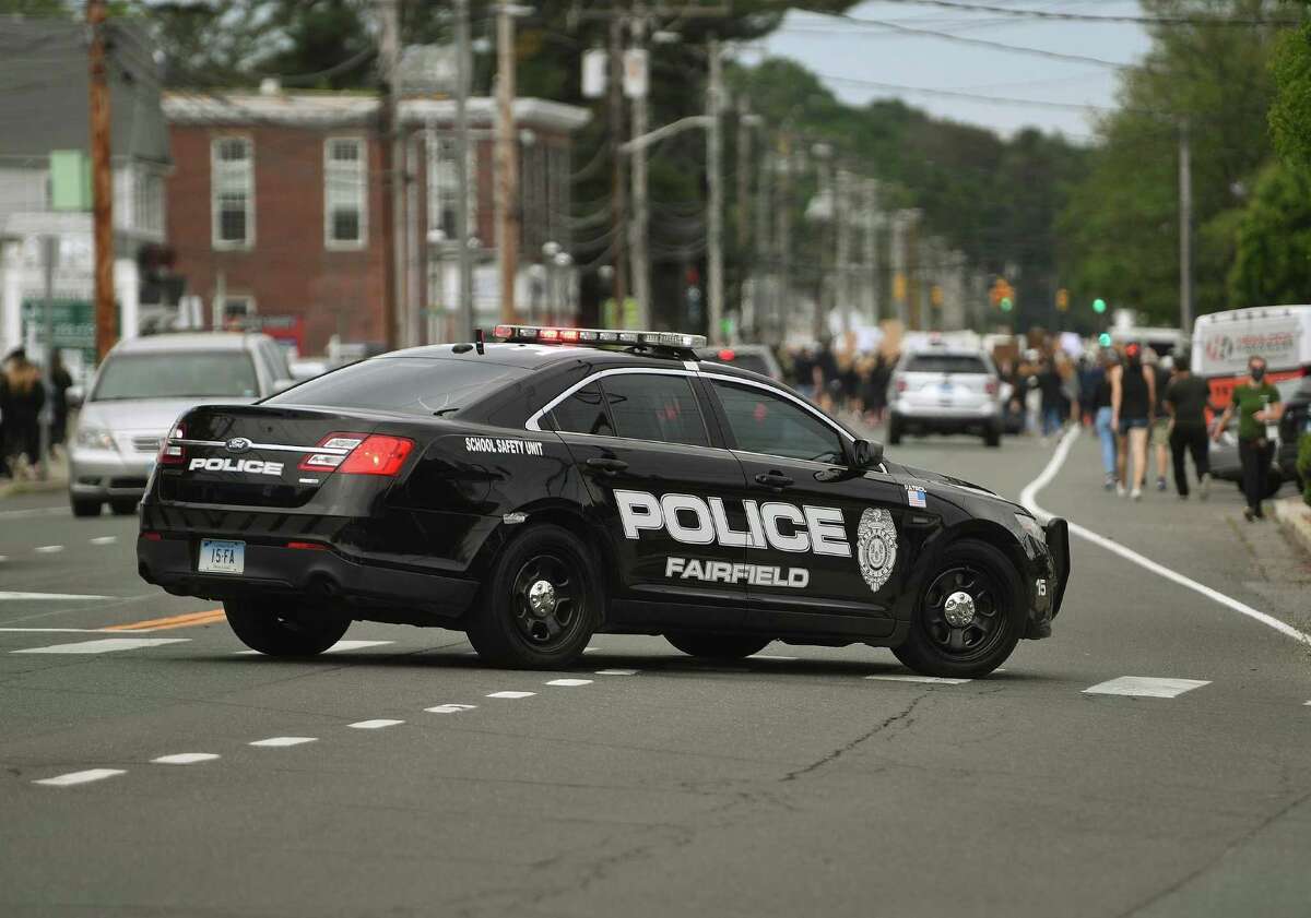 Protestors chant slogans while marching down the Post Road during an organized Black Lives Matter police brutality protest in Fairfield on June 2.