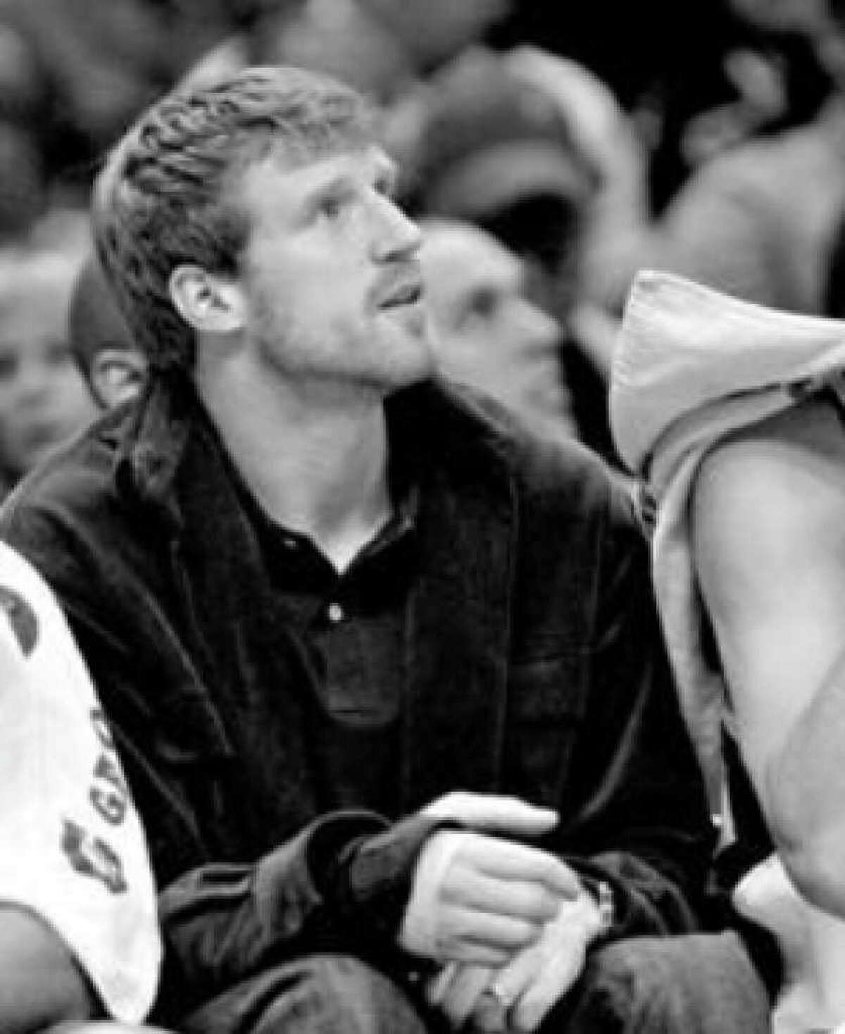 The Spurs' Matt Bonner sits on the bench after breaking a bone in his right hand in Saturday's game against the Pacers.