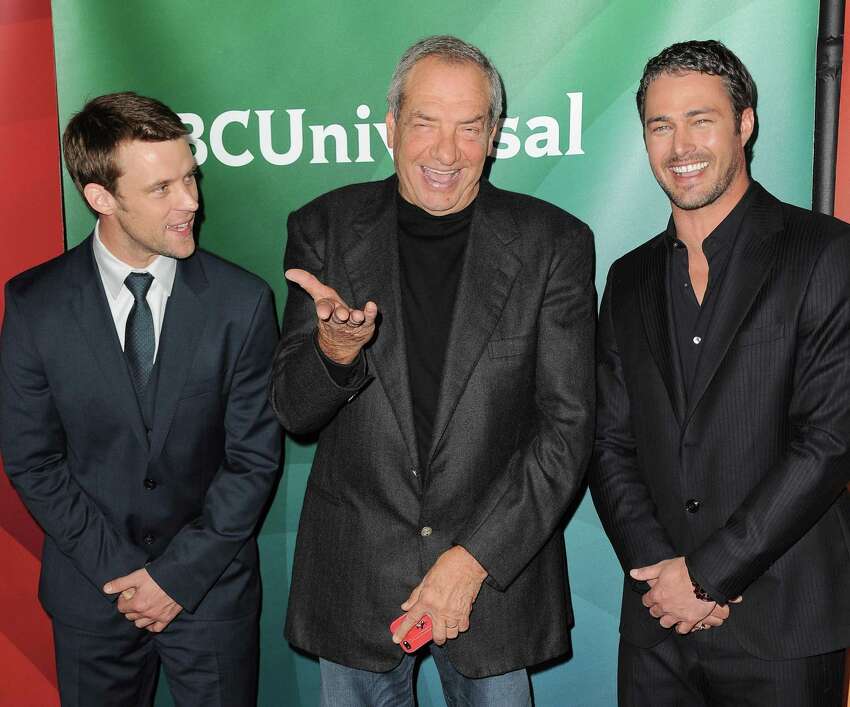 From left, Jesse Spencer, Dick Wolf and Taylor Kinney of NBC's 