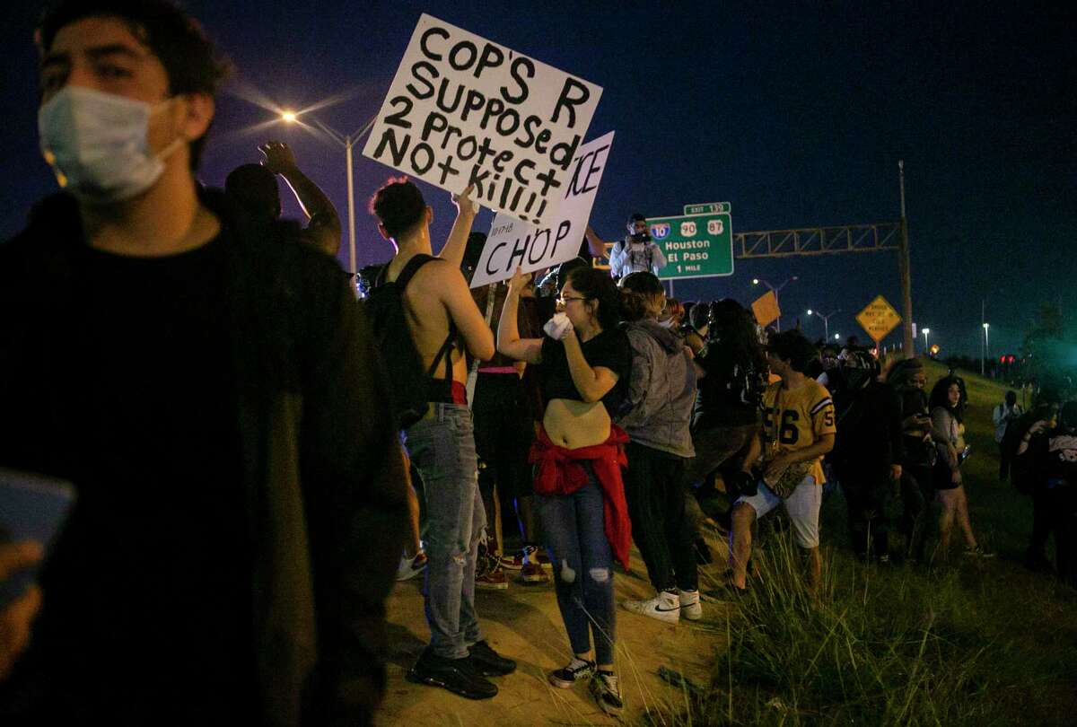 Demonstrators stand on the hill next to U.S. Highway 281-South during a demonstration in downtown San Antonio, Texas, on June 2, 2020. Local activist groups planned another protest of the death of George Floyd, a Minneapolis man who died in the custody of a Minneapolis police officer May 25.