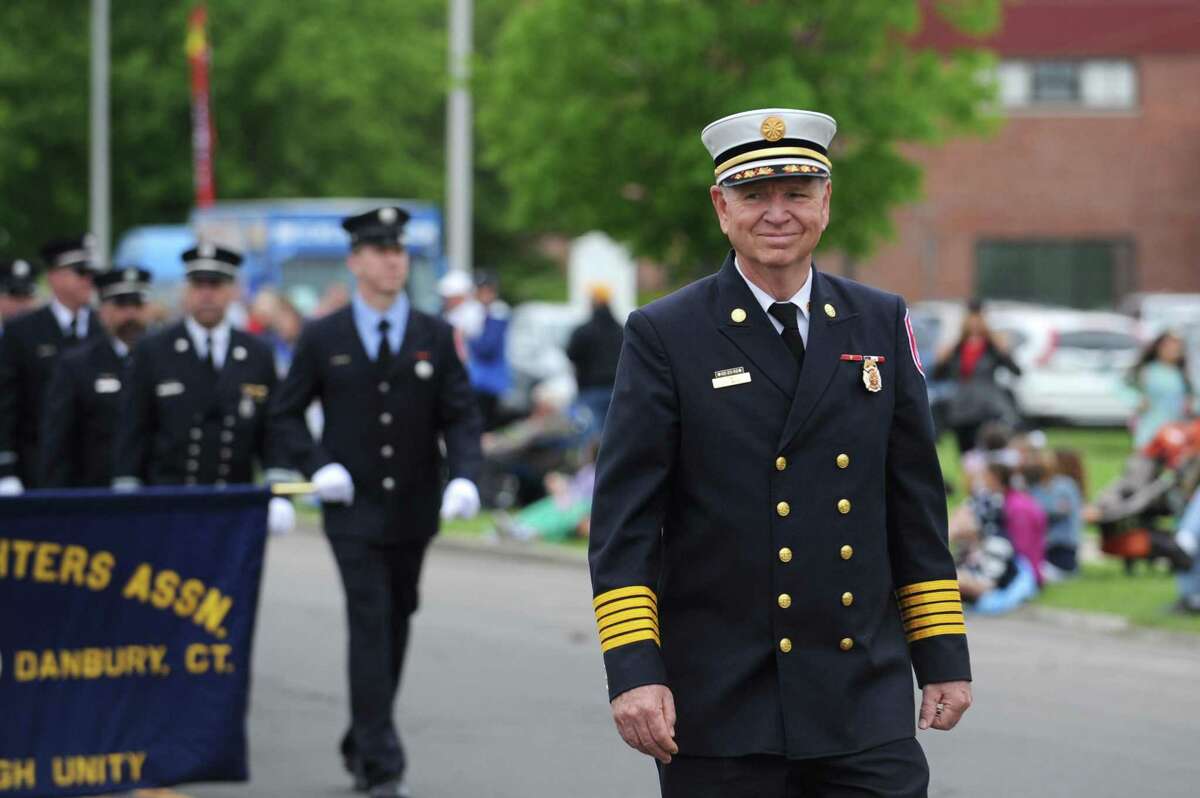 Danbury Fire Chief TJ Wiedl marches in Danbury's annual Memorial Day in 2018.