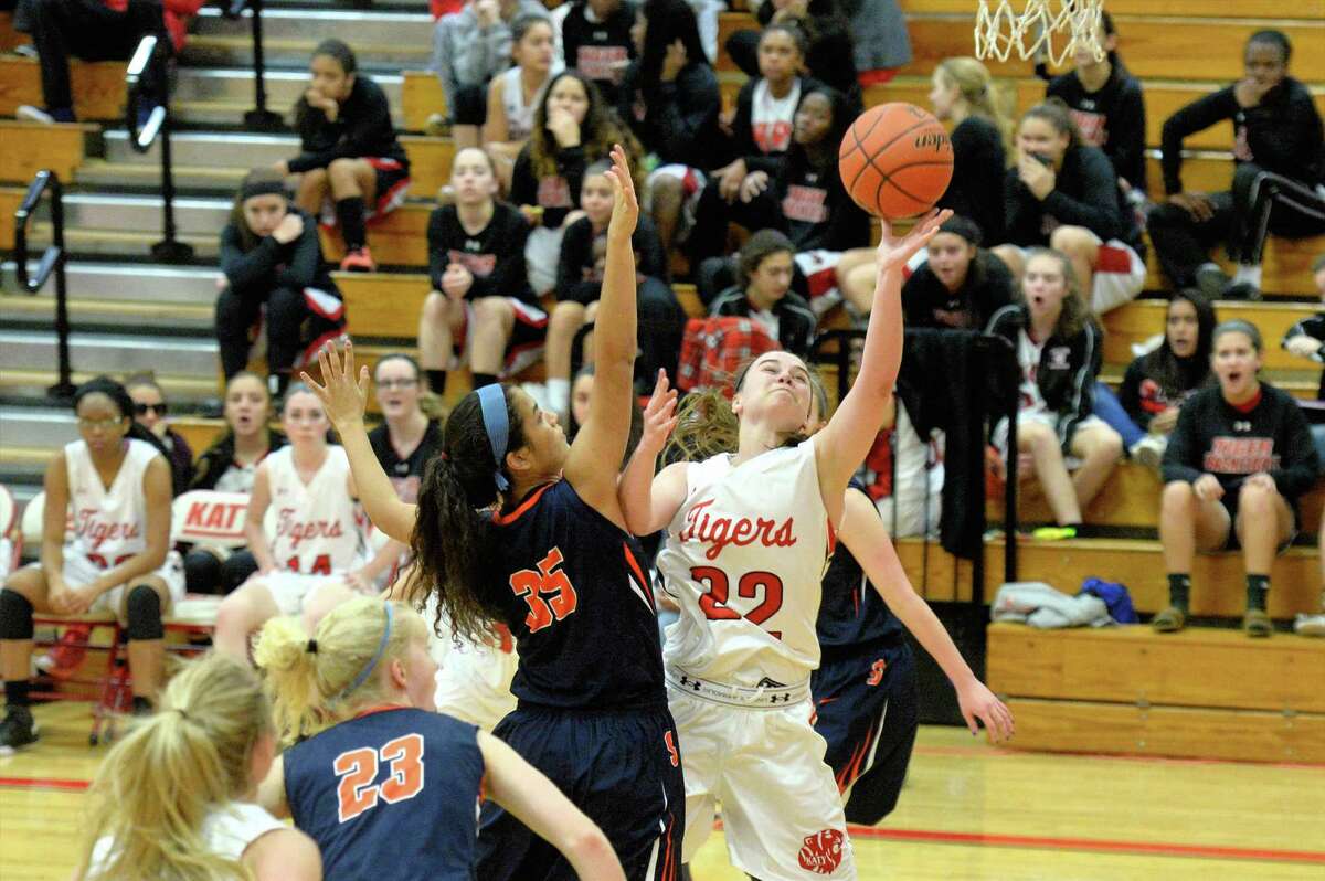 Katy's Kelley Skinner (22) shoots as Seven Lakes' Sara Pareja (35) defends during their District 19-6A game Jan. 2 at Katy High School. Seven Lakes and Katy were the top two teams in 19-6A and combined for three playoff wins.