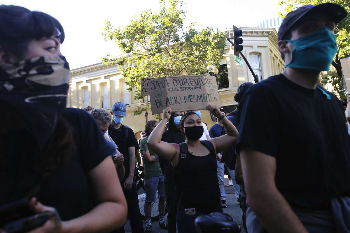 Demonstrators gathered at a police roadblock on Broadway in a solidarity protest against police brutality and the killing of black citizens in Oakland, Calif., on Tuesday, June 2, 2020. Protests have happened for days following the death of George Floyd in Minneapolis at the hands of police.