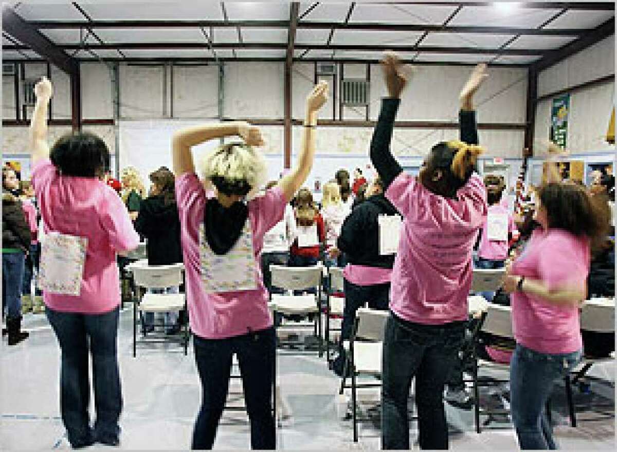 Girls dance to music provided by the Bulverde United Methodist Church at the Christmas party for the New Life Children's Center at Canyon Lake.