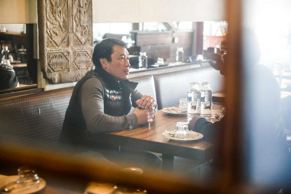 Desmond Tan (center), the owner of Burma Superstar sits for an interview at Burma Superstar in Oakland, California, on Thursday, Feb. 20, 2020.Tan�s newest restaurant Burma Bites will be focused on to-go and delivery.