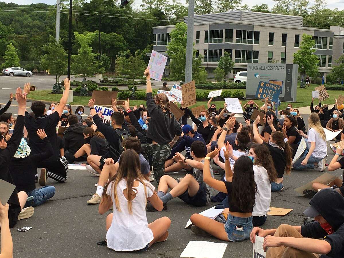 High school students were among the crowd of young people who staged a sit-in on June 2 in front of Wilton police headquarters to protest the death of George Floyd. A letter from 400 students and high school alum criticized the district for its lack of diversity and education policies.