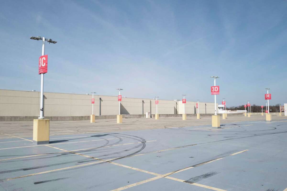 An empty parking lot is seen adjacent to the Westfield Mall in Annapolis, Md., on March 18. Department stores such as Macy's and Nordstrom are closed during the pandemic.