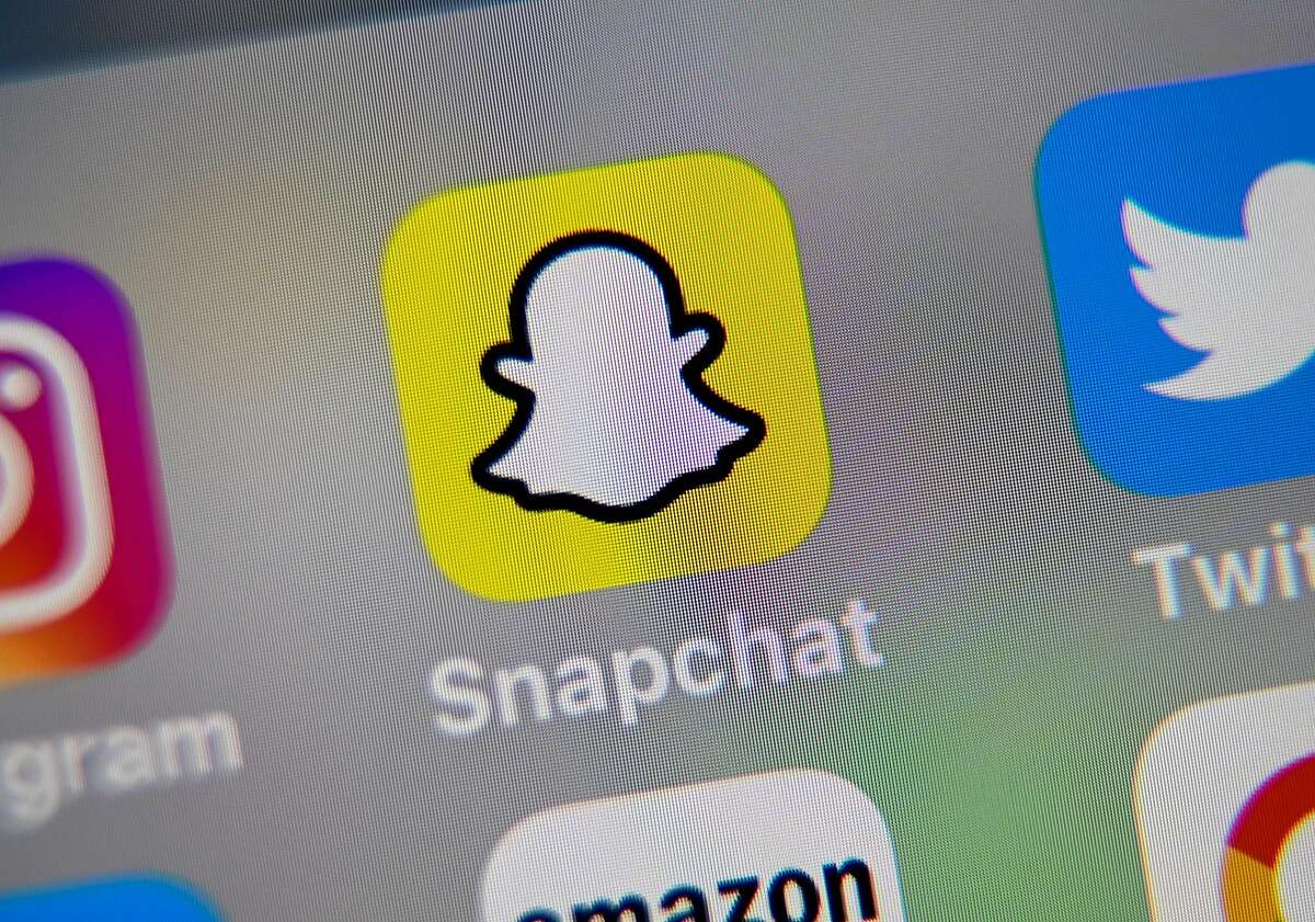 FILE: An illustration from Oct. 1, 2019, shows the logo of the mobile app Snapchat displayed on a tablet.