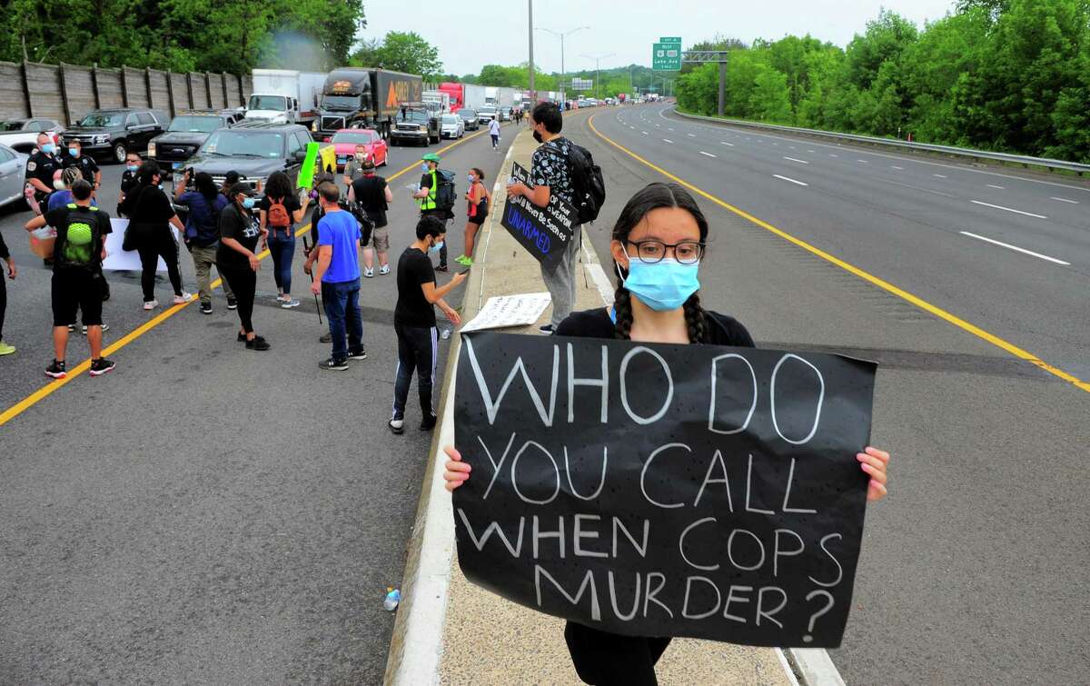 Demonstrators hold up traffic in both directions on Interstate 84 to protest police brutality in front of the police station in Danbury on Wednesday. The protest was one of dozens all over the country after the death of George Floyd in Minneapolis.